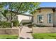 Beautifully landscaped front entrance with mature trees, native plants, and a welcoming walkway at 8336 S Homestead Ln, Tempe, AZ 85284