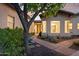 Inviting front entrance with a landscaped walkway and well-maintained garden and unique architecture at 8336 S Homestead Ln, Tempe, AZ 85284