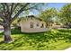 Charming home with a well-maintained lawn, mature trees, and a circular driveway enhancing its curb appeal at 8336 S Homestead Ln, Tempe, AZ 85284