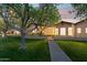 Beautiful home with a well-manicured lawn and mature trees at 8336 S Homestead Ln, Tempe, AZ 85284