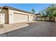 Spacious three-car garage with a large driveway, providing ample parking and storage space at 8336 S Homestead Ln, Tempe, AZ 85284