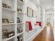 Bright hallway with white shelving, shiplap accent wall and bench seating at 8336 S Homestead Ln, Tempe, AZ 85284
