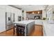 Open kitchen design with a large central island, stainless steel appliances, and hardwood floors at 8336 S Homestead Ln, Tempe, AZ 85284