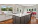 Beautiful kitchen island and countertops, plus hardwood floors, and modern appliances at 8336 S Homestead Ln, Tempe, AZ 85284