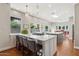 Bright kitchen with double islands, breakfast bar seating, and lots of natural light at 8336 S Homestead Ln, Tempe, AZ 85284