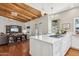 Gourmet kitchen featuring a large island, stainless steel appliances and hardwood floors at 8336 S Homestead Ln, Tempe, AZ 85284