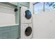 Functional laundry room with stacked washer and dryer, providing convenience at 8336 S Homestead Ln, Tempe, AZ 85284