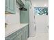 Efficient laundry room with stackable washer/dryer and ample storage space at 8336 S Homestead Ln, Tempe, AZ 85284