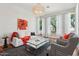 Stylish living room with hardwood floors, neutral decor, and an elegant chandelier at 8336 S Homestead Ln, Tempe, AZ 85284