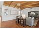 Open-concept living room with vaulted wood ceiling, hardwood floors and custom built ins at 8336 S Homestead Ln, Tempe, AZ 85284