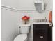 Elegant powder room features dark vanity, marble countertop, and stylish decor at 8336 S Homestead Ln, Tempe, AZ 85284