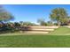 Well-maintained community outdoor amphitheater with tiered seating and lush green lawn at 8542 E Indigo St, Mesa, AZ 85207