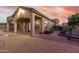 Lovely covered back patio with brick pavers and view of landscaped backyard at 8542 E Indigo St, Mesa, AZ 85207