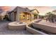 Comfortable outdoor living space featuring a fire pit and outdoor patio furniture at 8542 E Indigo St, Mesa, AZ 85207