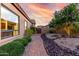 Beautiful desert landscaping in backyard with brick paver walkway and desert sunset at 8542 E Indigo St, Mesa, AZ 85207