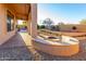 Spacious patio with an outdoor firepit and covered area at 8542 E Indigo St, Mesa, AZ 85207