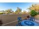Cozy outdoor dining area with brick pavers and perimeter block wall at 8542 E Indigo St, Mesa, AZ 85207