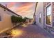 Brick paved backyard with desert landscaping and view of perimeter wall at 8542 E Indigo St, Mesa, AZ 85207