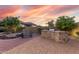 Brick paved backyard featuring a built-in grill and desert landscaping at 8542 E Indigo St, Mesa, AZ 85207