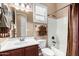 Cozy bathroom featuring a shower-tub, sink, medicine cabinet and a window with natural light at 8542 E Indigo St, Mesa, AZ 85207