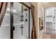 Bathroom featuring glass shower with bronze hardware and view to spacious walk-in closet at 8542 E Indigo St, Mesa, AZ 85207