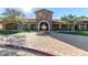 Stone community center entrance showcasing a decorative fountain and wrought iron gates at 8542 E Indigo St, Mesa, AZ 85207