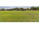 Expansive green community park with shaded picnic areas and a colorful playground, perfect for outdoor activities and Gathering fun at 8542 E Indigo St, Mesa, AZ 85207