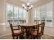 Cozy dining area with a marble table, ornate chairs, and plantation shutters at 8542 E Indigo St, Mesa, AZ 85207