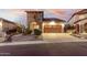 Home exterior showcasing stone accents, desert landscaping, and a brick driveway at 8542 E Indigo St, Mesa, AZ 85207