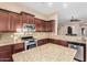 Well-equipped kitchen featuring granite countertops, stainless steel appliances, and ample cabinet space at 8542 E Indigo St, Mesa, AZ 85207