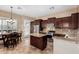 Well-equipped kitchen with stainless steel appliances, granite countertops, and breakfast bar at 8542 E Indigo St, Mesa, AZ 85207