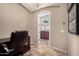 Office featuring tile floors, a desk and chair and access to another room via an arched doorway at 8542 E Indigo St, Mesa, AZ 85207
