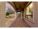 Covered patio area with brick pavers, archways and natural light offering views of the backyard at 8542 E Indigo St, Mesa, AZ 85207