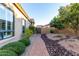 Charming walkway with brick pavers, rocks and landscaped yard at 8542 E Indigo St, Mesa, AZ 85207