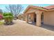A cozy covered patio area with a low maintenance rock yard at 8877 E Riviera Dr, Scottsdale, AZ 85260