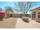 Backyard with a desert landscape, paved patio, and outdoor dining set, ideal for enjoying the Arizona weather at 8877 E Riviera Dr, Scottsdale, AZ 85260