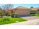 Charming single-story home featuring a terra cotta roof and a two-car garage at 8877 E Riviera Dr, Scottsdale, AZ 85260