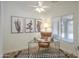 Bright home office with a glass desk, cactus artwork, and a comfortable chair, perfect for a productive workspace at 8877 E Riviera Dr, Scottsdale, AZ 85260