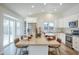 Spacious kitchen with stainless steel appliances and white cabinets, complemented by a large island at 8877 E Riviera Dr, Scottsdale, AZ 85260