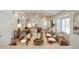 Bright open-concept living area with stainless appliances, white kitchen island, and modern furnishings at 8877 E Riviera Dr, Scottsdale, AZ 85260