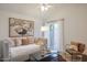 Cozy room showcasing a sofa, decor, and a sliding glass door to outdoor area at 8877 E Riviera Dr, Scottsdale, AZ 85260