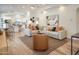 Open-concept living room with modern furnishings and wood tile flooring at 8877 E Riviera Dr, Scottsdale, AZ 85260