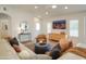 Spacious living room with modern decor and an adjacent dining area at 8877 E Riviera Dr, Scottsdale, AZ 85260