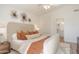 Well-lit main bedroom with neutral tones and a serene ambiance, features art at 8877 E Riviera Dr, Scottsdale, AZ 85260