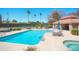 Community pool featuring an in-ground pool, hot tub, and lounge area at 8877 E Riviera Dr, Scottsdale, AZ 85260