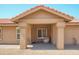 Inviting covered front porch with neutral color scheme and tiled floor at 8877 E Riviera Dr, Scottsdale, AZ 85260