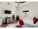 Bedroom with a TV, modern furniture, and a view to the outdoors at 9401 N 122Nd Pl, Scottsdale, AZ 85259