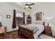 Bedroom with natural light, wood accents, and decorative artwork at 9401 N 122Nd Pl, Scottsdale, AZ 85259