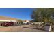 Desert home with a gravel driveway, a well-manicured yard, and two-car garage at 9401 N 122Nd Pl, Scottsdale, AZ 85259