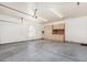 Spacious garage with cabinets, tool storage, and ample room for vehicles or projects at 9401 N 122Nd Pl, Scottsdale, AZ 85259